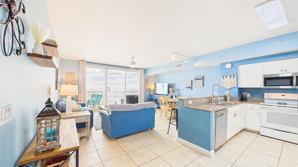Walk into your openly designed kitchen and living areas where coastal design meets comfort.
