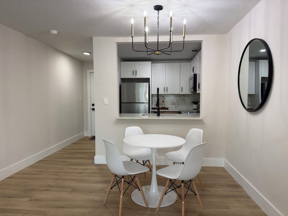 Your stylish dining area flows seamlessly into the modern kitchen, creating the perfect space for memorable meals and conversations.