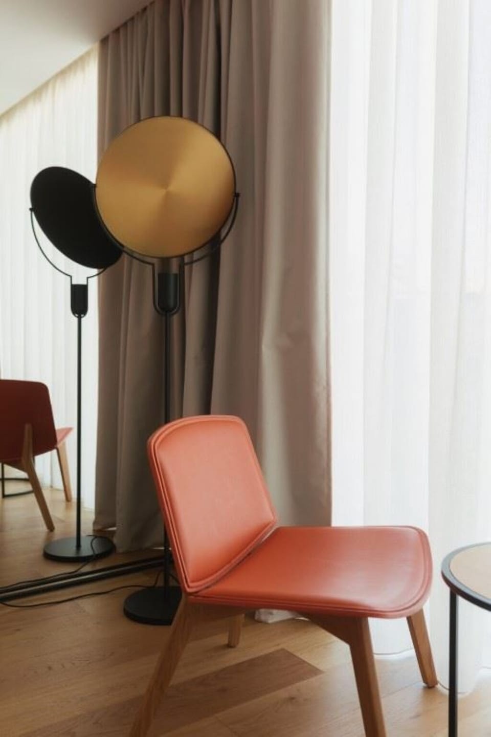 Arrive to a warm, polished lobby with serene lighting.
