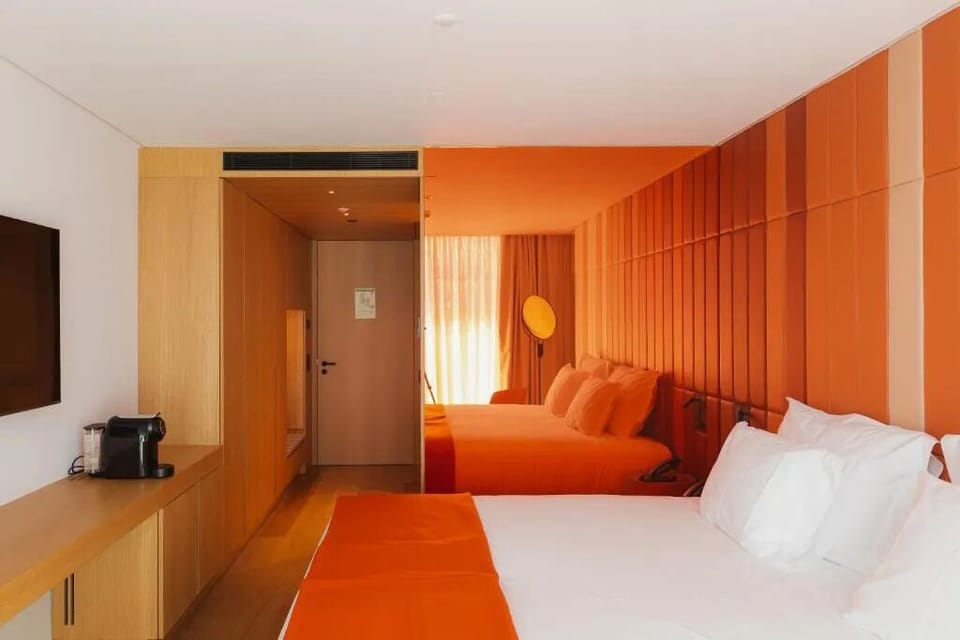 Step into a vibrant suite and relax on cloud-soft beds.