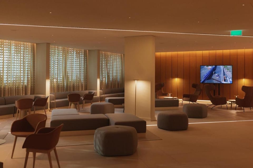 Relax in the plush lounge with soft light and calm seating.