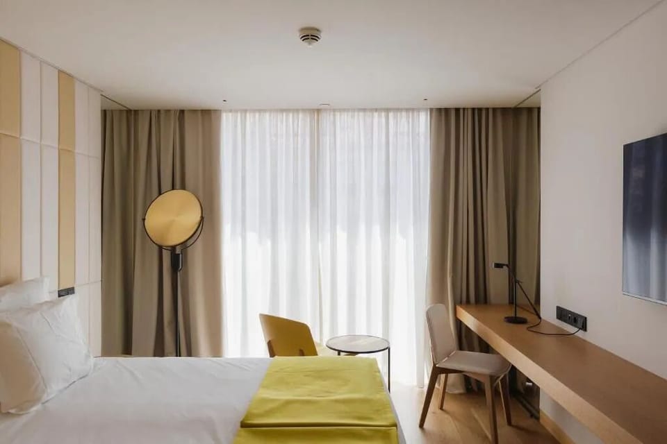 Settle in with a spacious desk and airy window views.