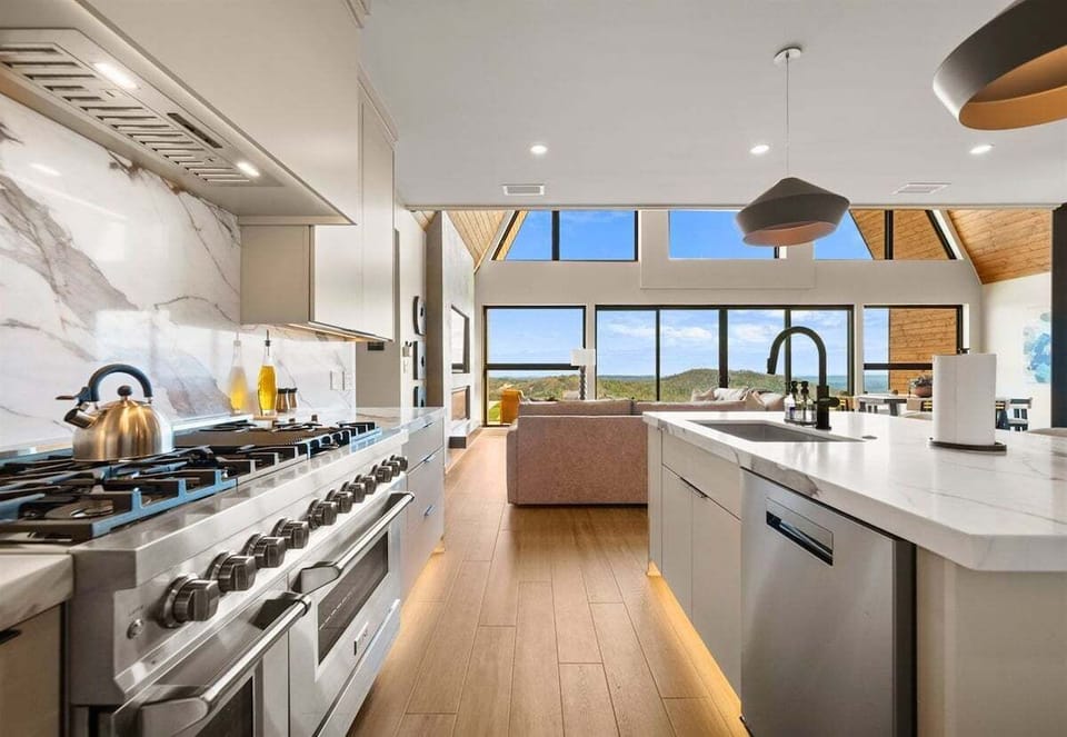 Hosting is a breeze in this beautiful kitchen, with plenty of space to prep, serve, and gather while still feeling connected to the rest of the home.