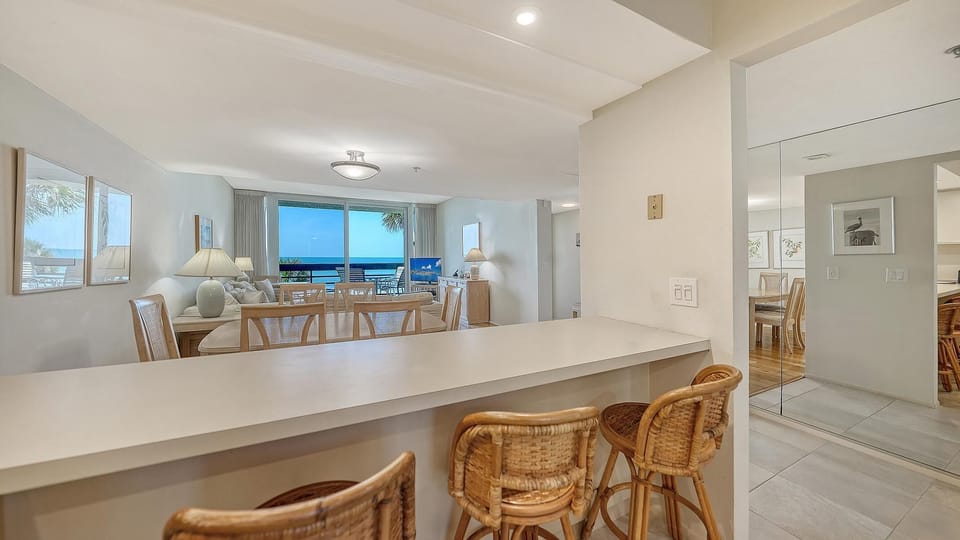 Bright open kitchen and dining area with cozy seating
