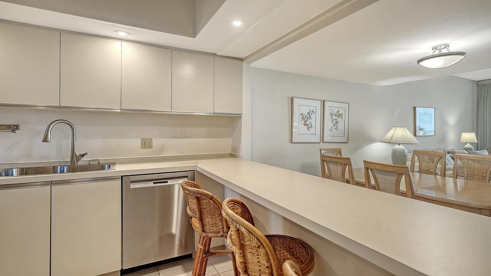Bright, open kitchen with cozy breakfast bar seating