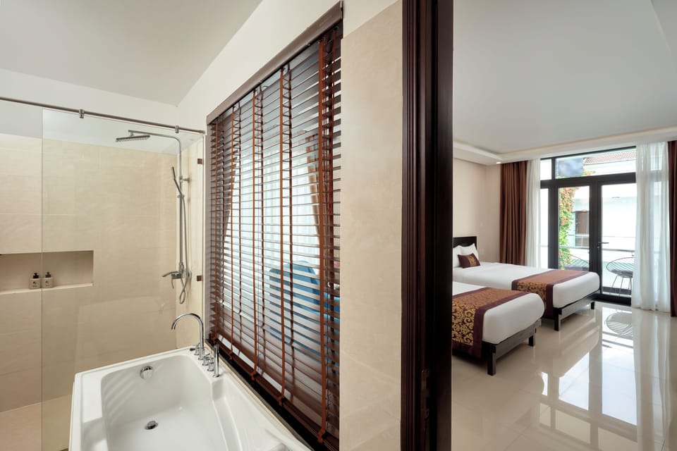Combined shower/tub, free toiletries, hair dryer, slippers