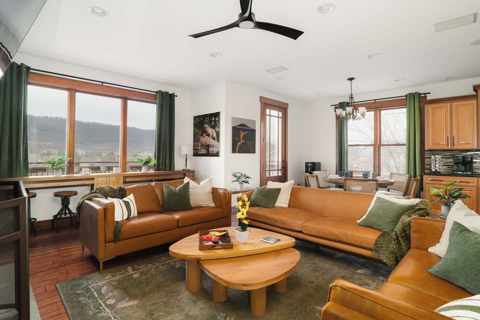 A spacious living area with scenic views and comfortable seating — ideal for spreading out or enjoying quieter moments.
