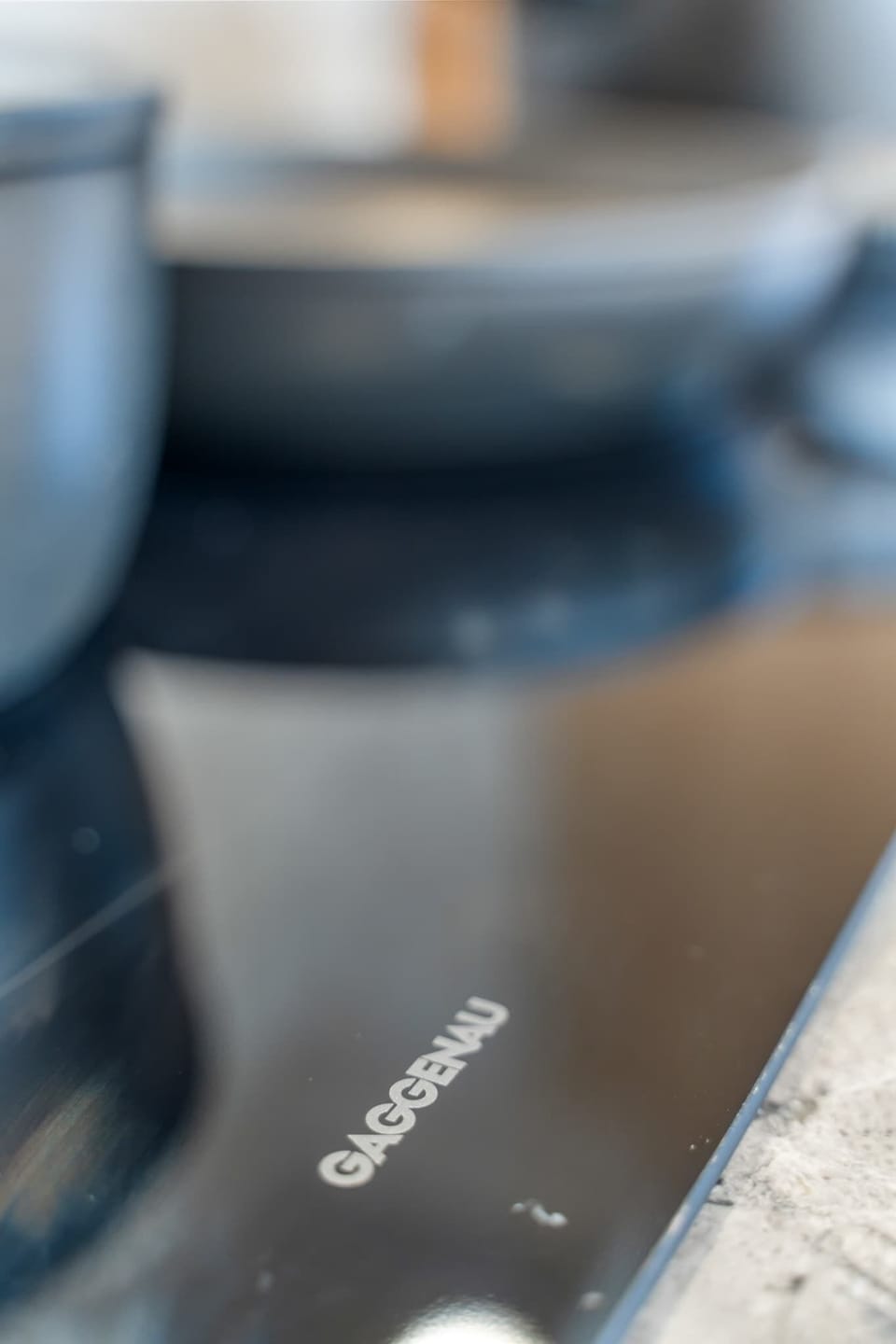 Gaggenau induction cooktop paired with premium Essteele cookware, ideal for everyday cooking or longer stays.