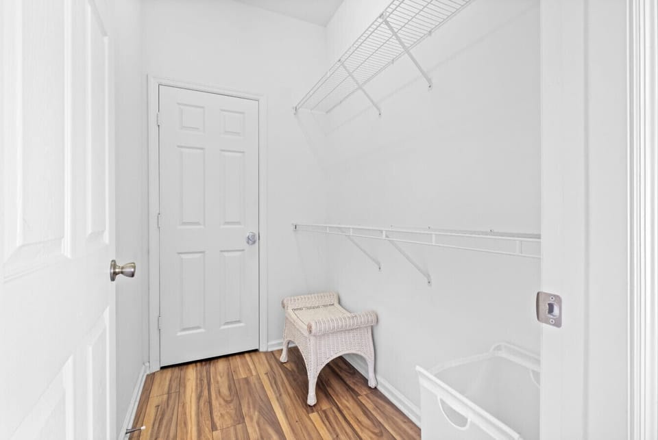 Walk-in closet with shelving and hanging space