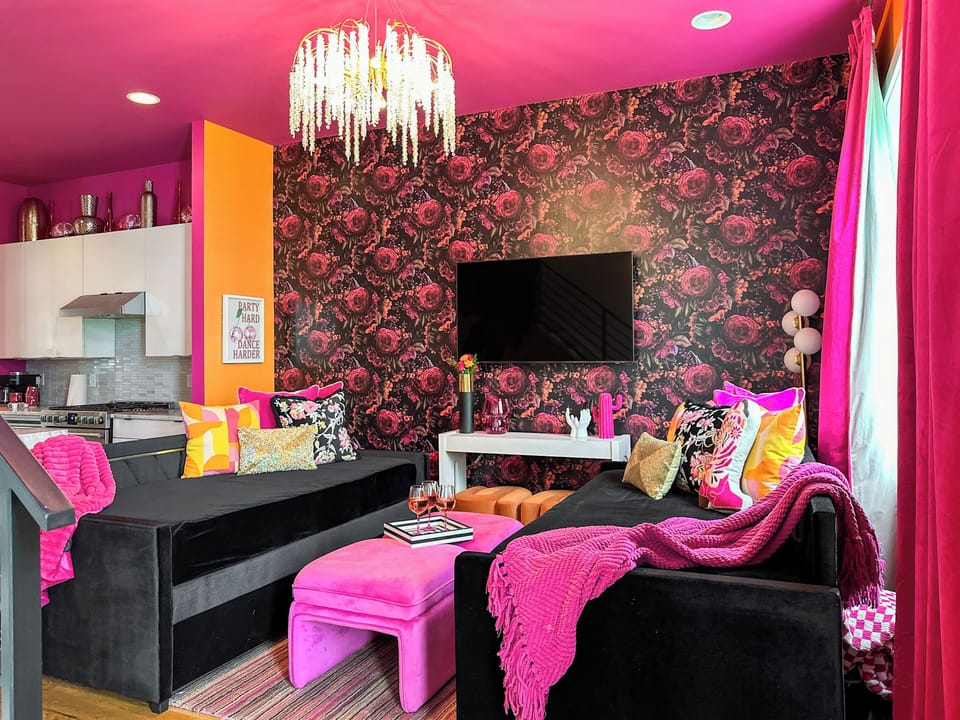 Living Room – Second Floor: Open living space with TV and seating