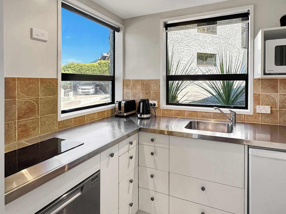 Clean and convenient kitchen with amenities provided for a seamless stay