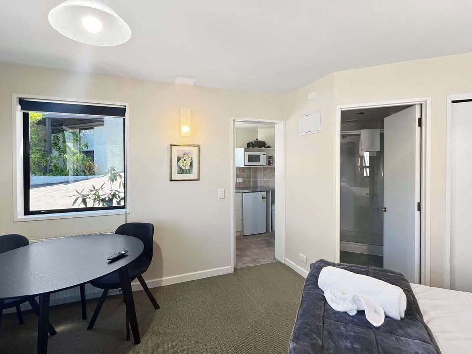 Open-plan studio layout with kitchenette access