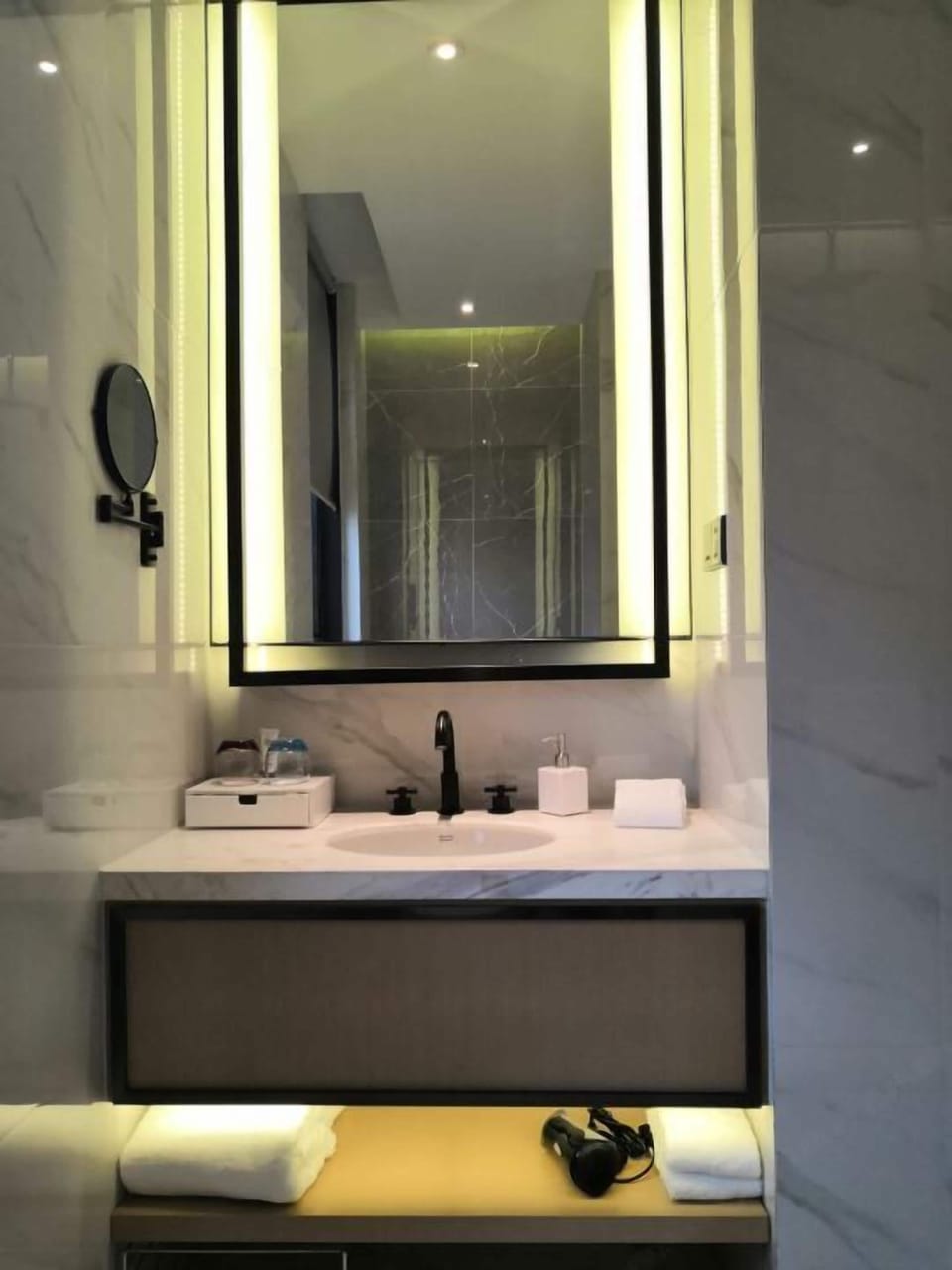 Shower, hair dryer, slippers, towels