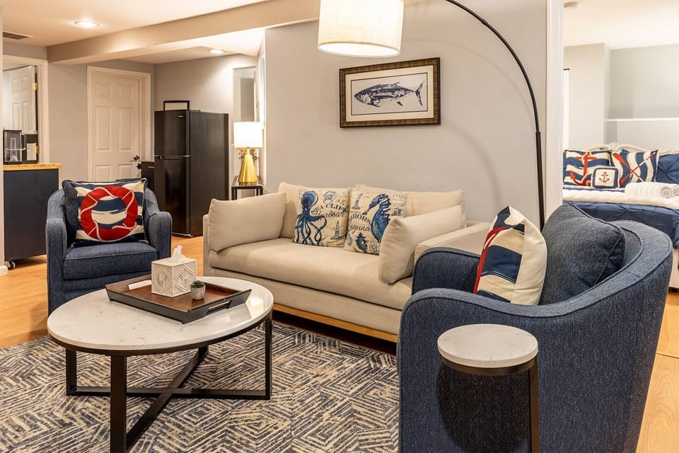 The family room is centrally located in the apartment between the bedrooms and kitchenette.
