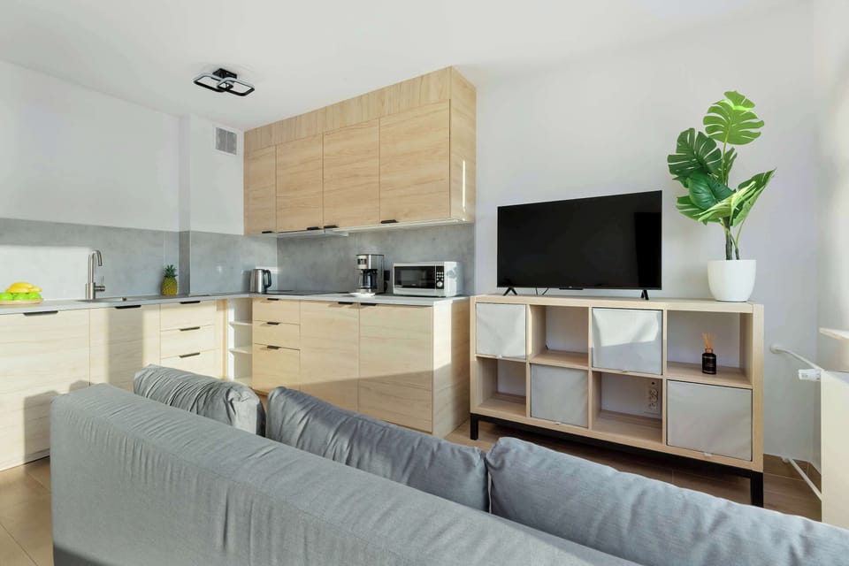 The elegant living area featuring a double sofa bed, perfect for relaxing or sleeping.