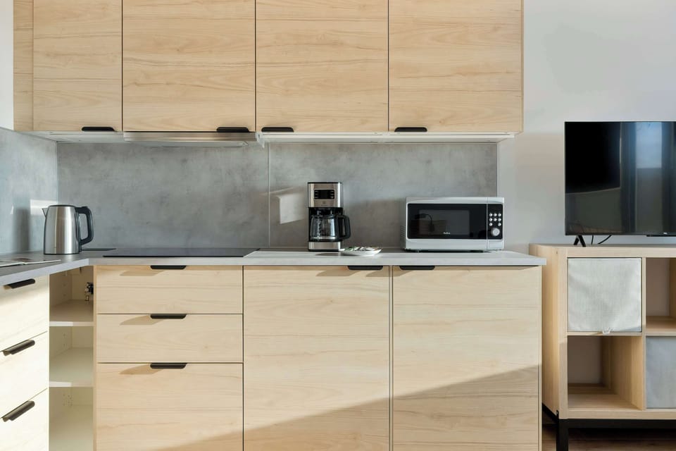 The kitchenette's practical layout maximizes space and functionality.
