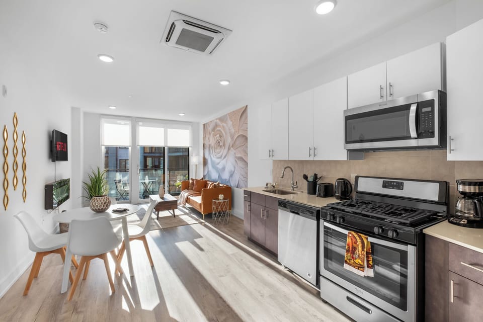 Bright and airy apartment offering a seamless blend of living, kitchen and dining areas.
