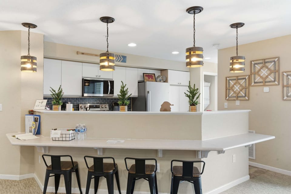 Open kitchen with bar seating for 4—cook up memories together