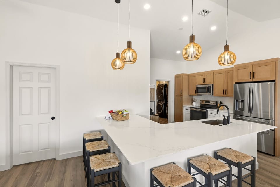 Chef’s kitchen with oversized island and seating for the whole group
