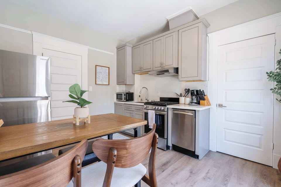 Bright and functional kitchen stocked with everything you need for a home-cooked meal.