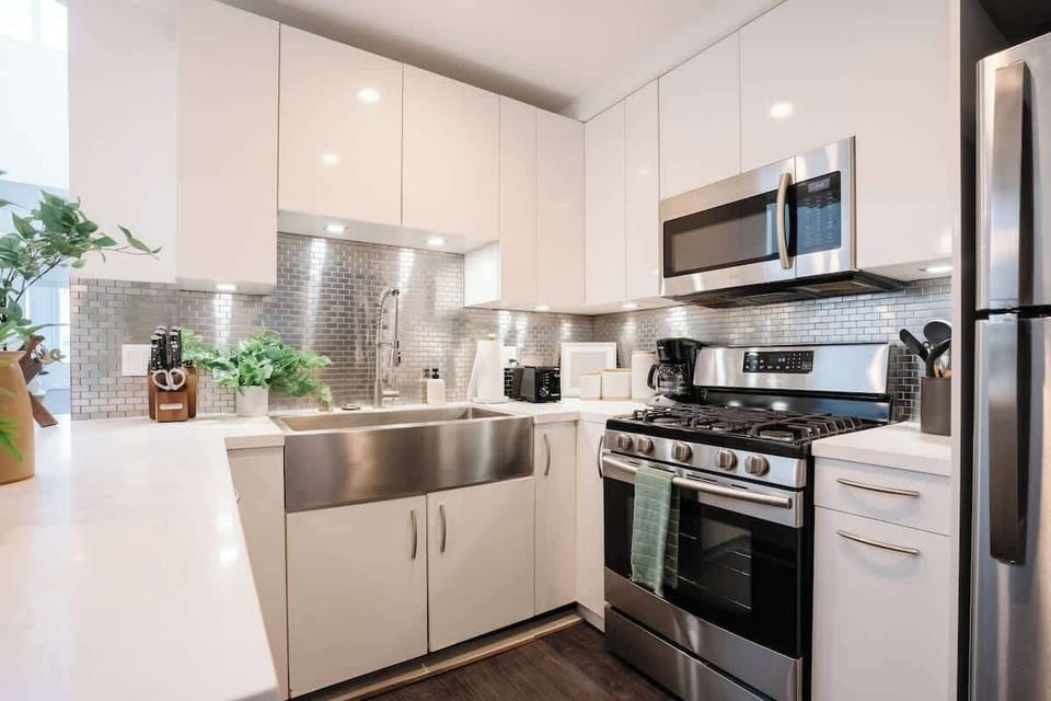 The kitchen comes fully equipped with high-end appliances 