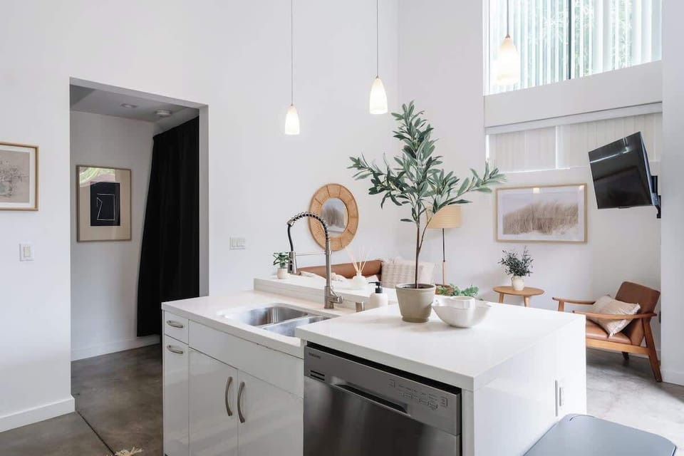 Socialize with friends while you cook in the kitchen overlooking the living space