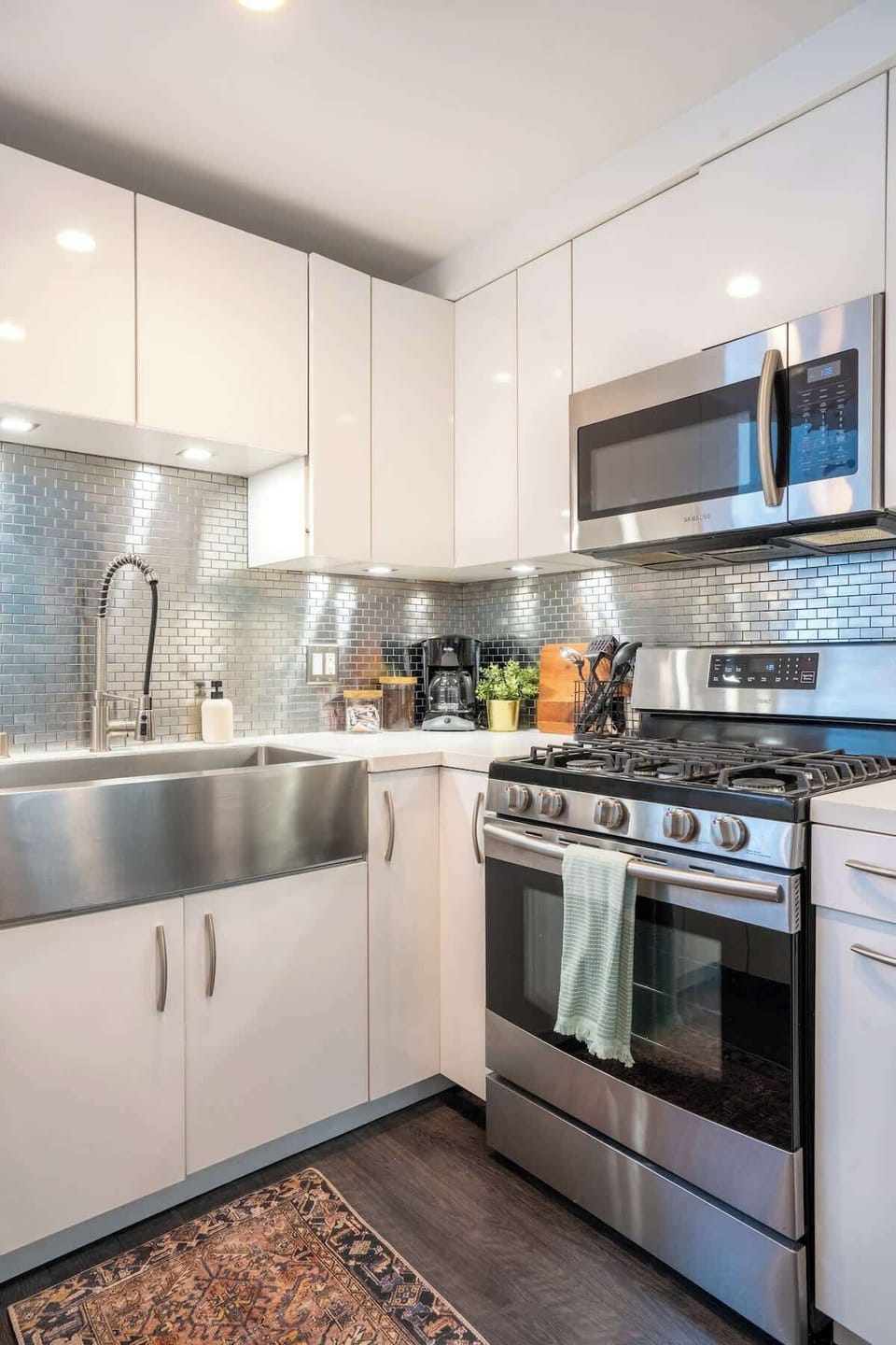 The kitchen comes fully equipped with high-end appliances 