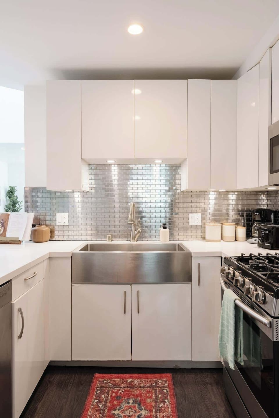 The kitchen comes fully equipped with high-end appliances 