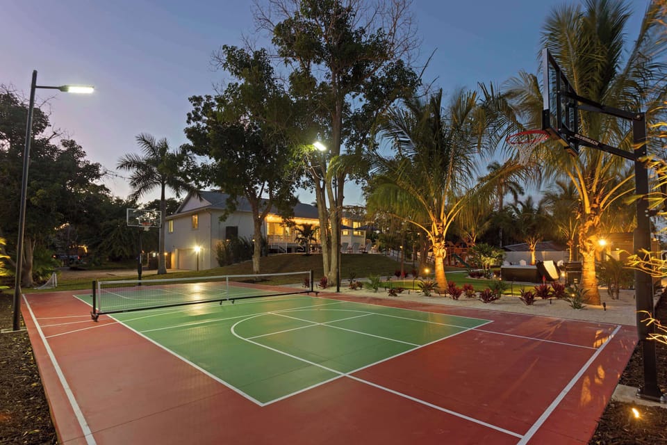 Recreation Area: Enjoy evening games under the stars with our vibrant courts and palm-fringed paradise!