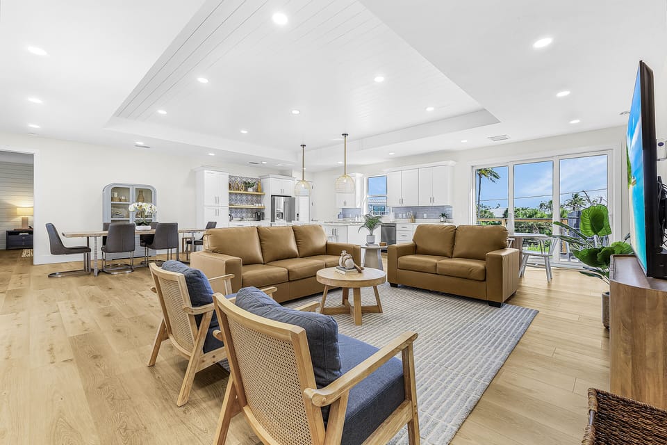 Spacious living area with plenty of seating and big screen TV