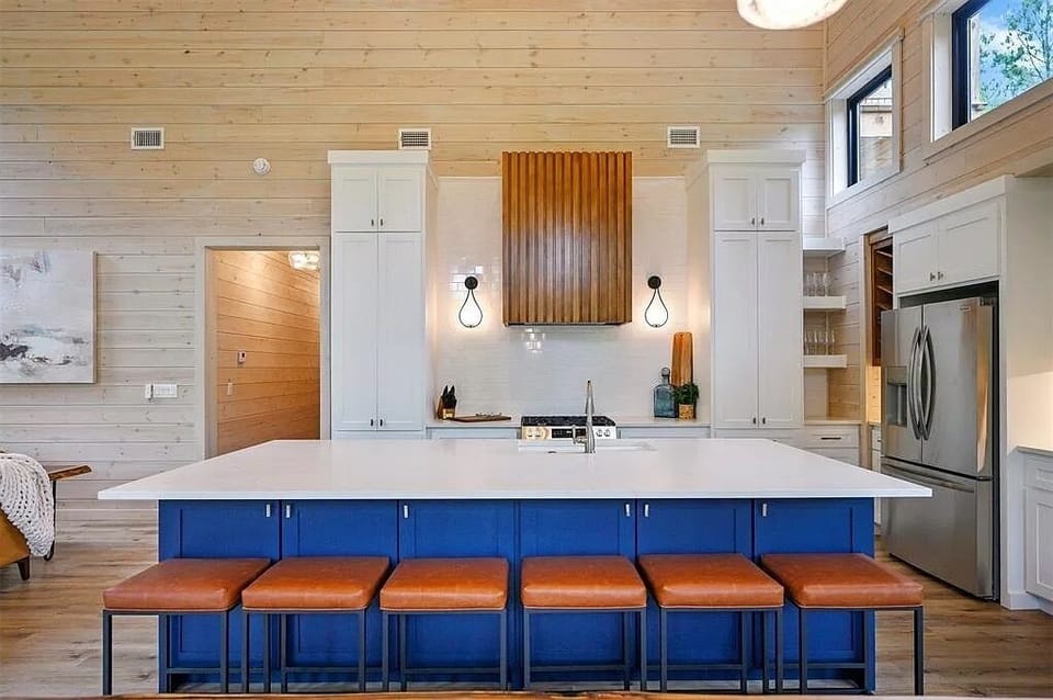 Gourmet Kitchen: Whip up meals in style with this vibrant island and modern appliances!