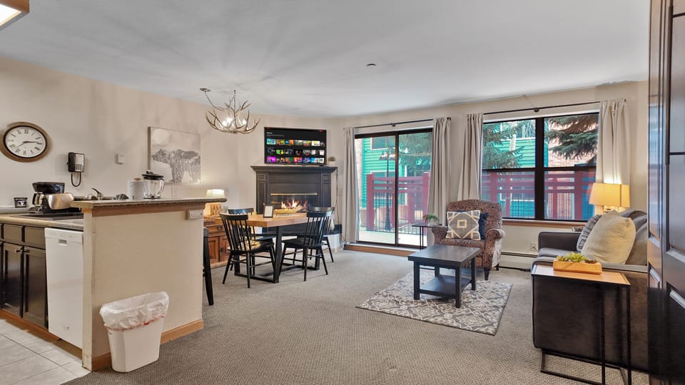 Open living space connecting to dining, perfect for relaxing or entertaining.