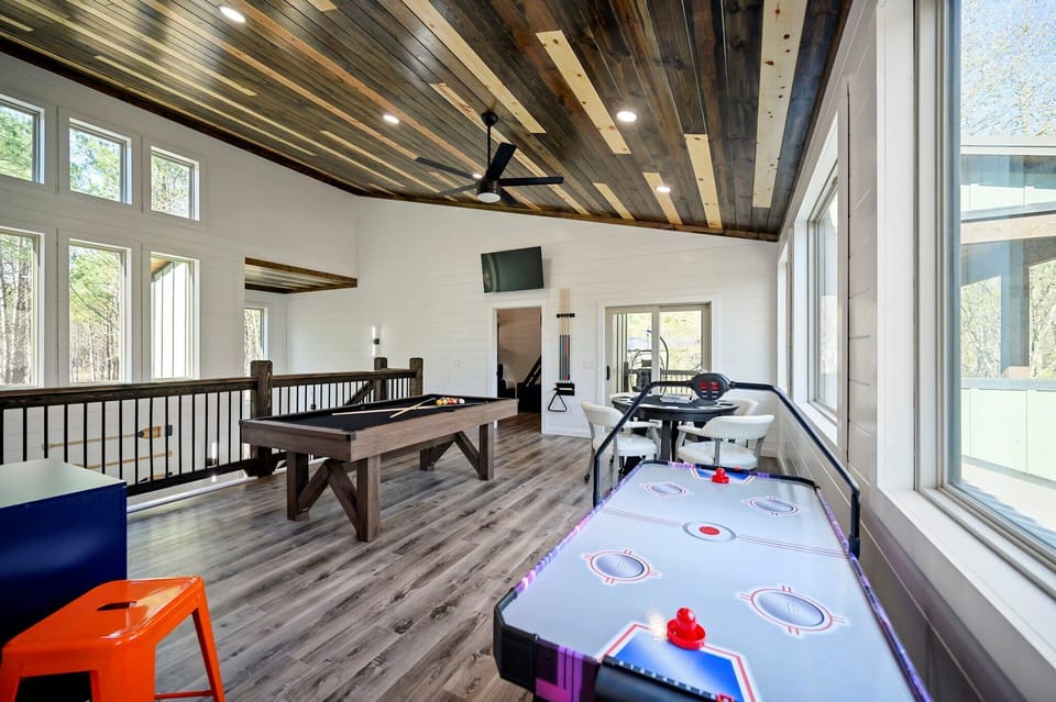 Loft area with pool table, poker table, air hockey, games, Ms. Pacman, foosball, and Smart TV