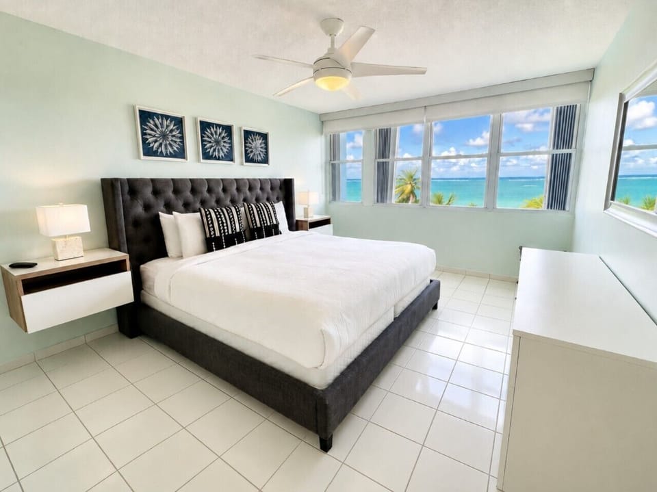 Unwind in this beautiful master bedroom, boasting a plush king bed and stunning ocean vistas