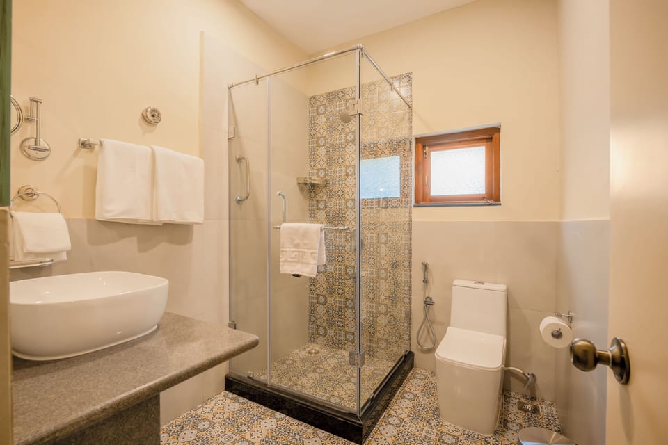 Fontainhas Heritage Suite | Bathroom | Hair dryer, towels, soap, shampoo