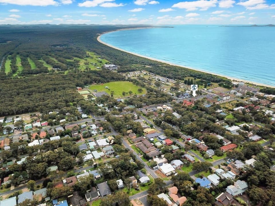 Arrow shows location near beach and golf course