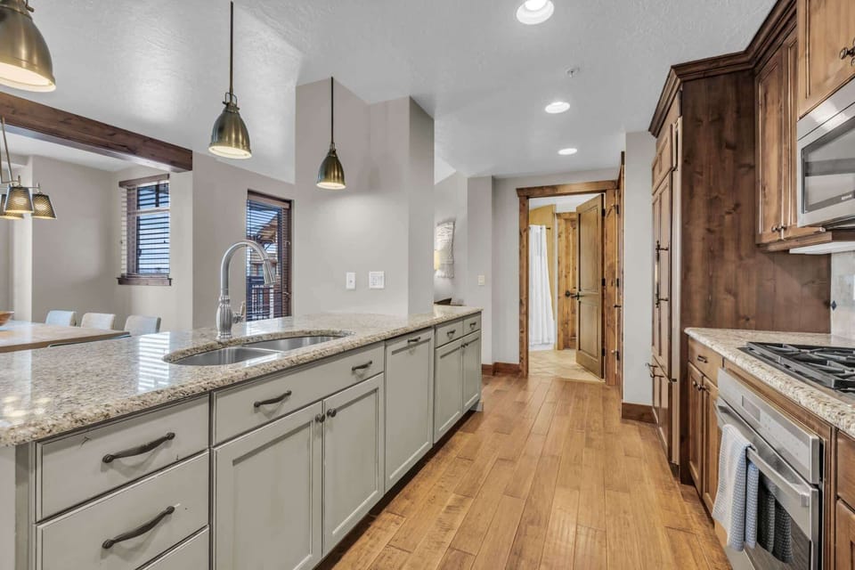 Unit B’s inviting open kitchen offers ample space & all the comforts of home​