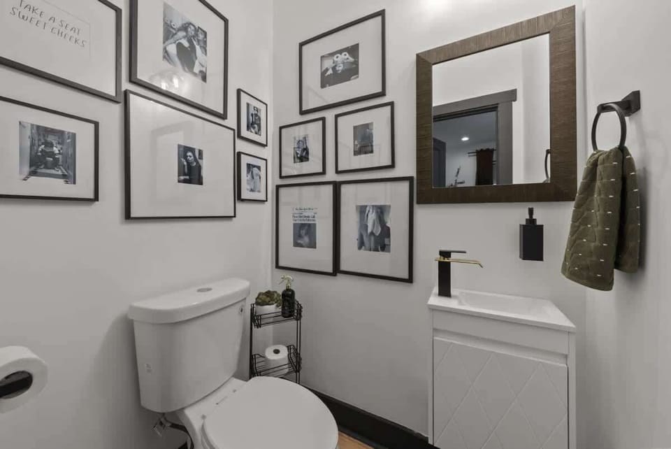 Stylish bathroom w/ framed art, clean finishes & a fresh, polished look throughout ✨