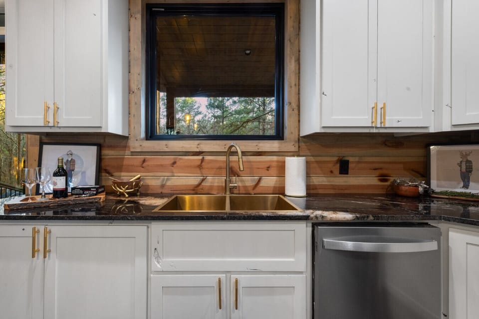 Even the cleanup is a treat with our high-end gold fixtures and a farmhouse sink that looks out over the peaceful Oklahoma pines.