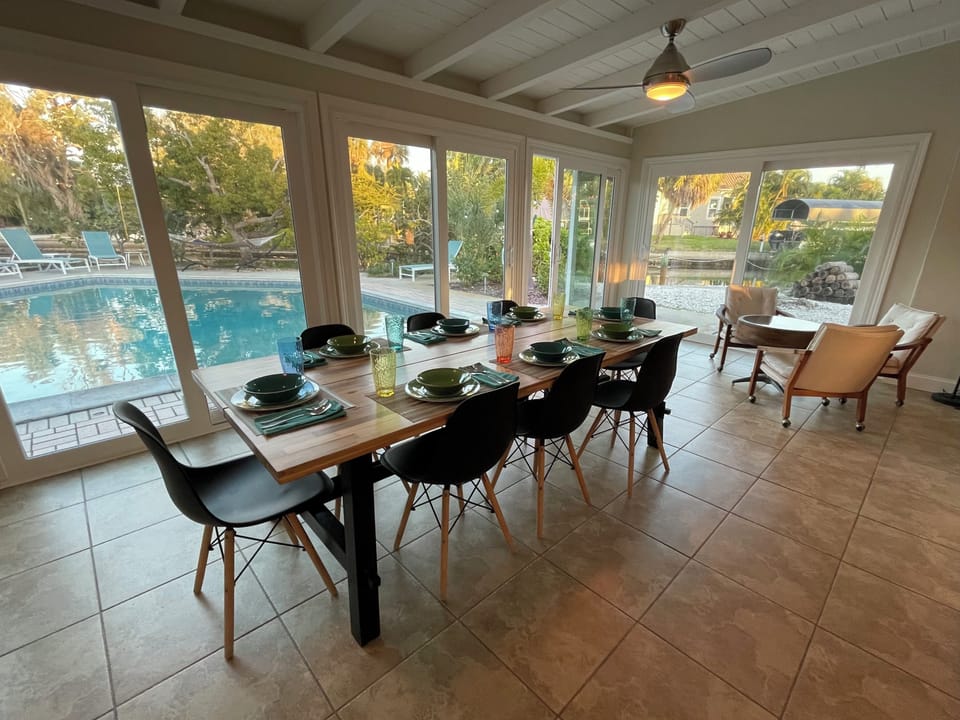Primary dining table and conversation area by pool