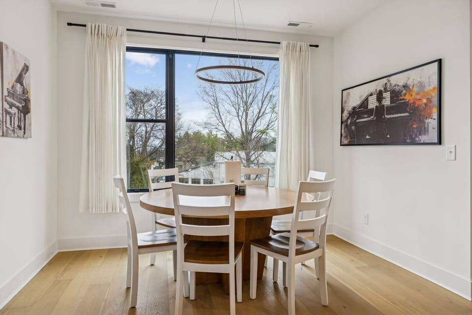 Dining Area: Enjoy intimate dinners or celebratory feasts in this chic dining area. With its sophisticated ambiance and beautiful natural light, it's crafted for unforgettable moments.