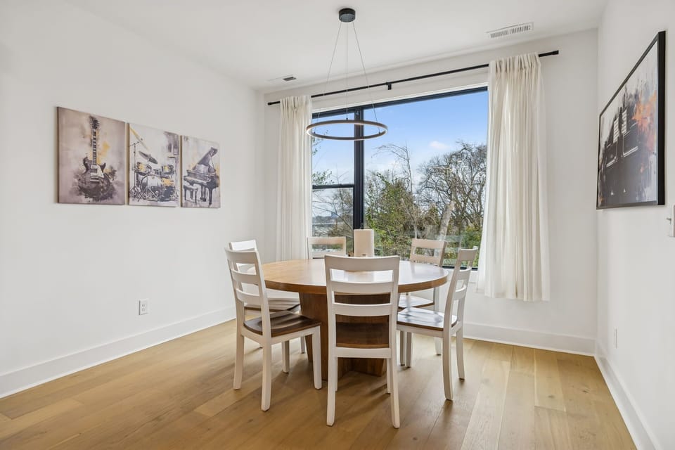 Dining Area: Enjoy intimate dinners or celebratory feasts in this chic dining area. With its sophisticated ambiance and beautiful natural light, it's crafted for unforgettable moments.