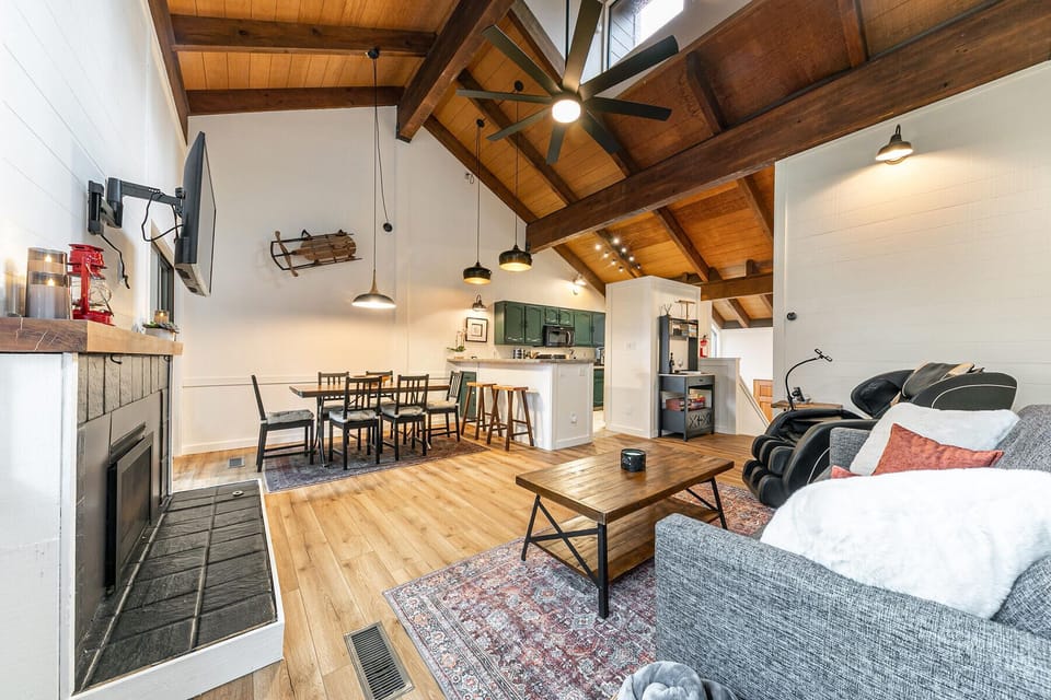 Spacious cabin living with vaulted ceilings and inviting gathering spaces.