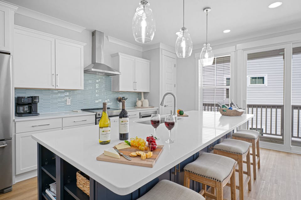 The chef's kitchen is the heart of the home, thoughtfully designed with a large island, stainless steel appliances, and everything you need to prepare and serve delicious meals.