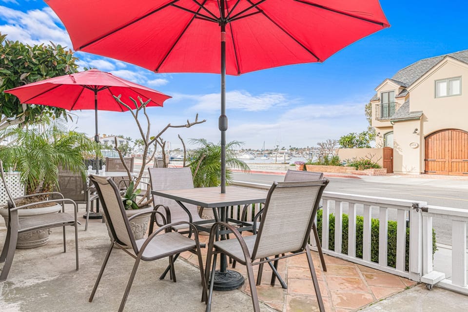The front patio offers sweeping views of the bay, creating an inviting setting for relaxed coastal moments
                
