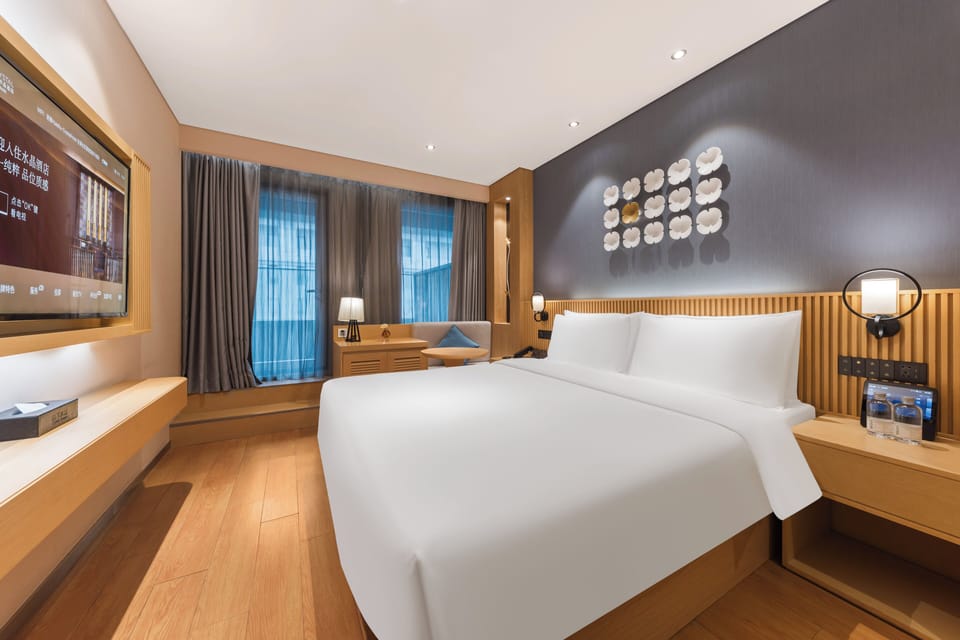 Deluxe Double Room, Patio, City View | Free minibar, individually decorated, individually furnished, desk