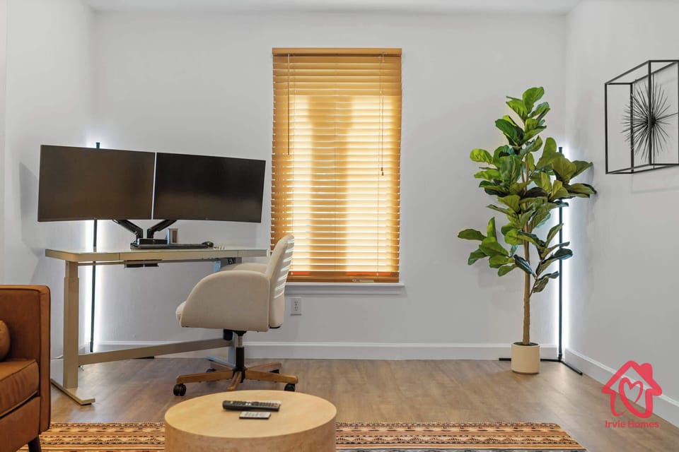 Sleek home office with dual monitors and ergonomic chair.
