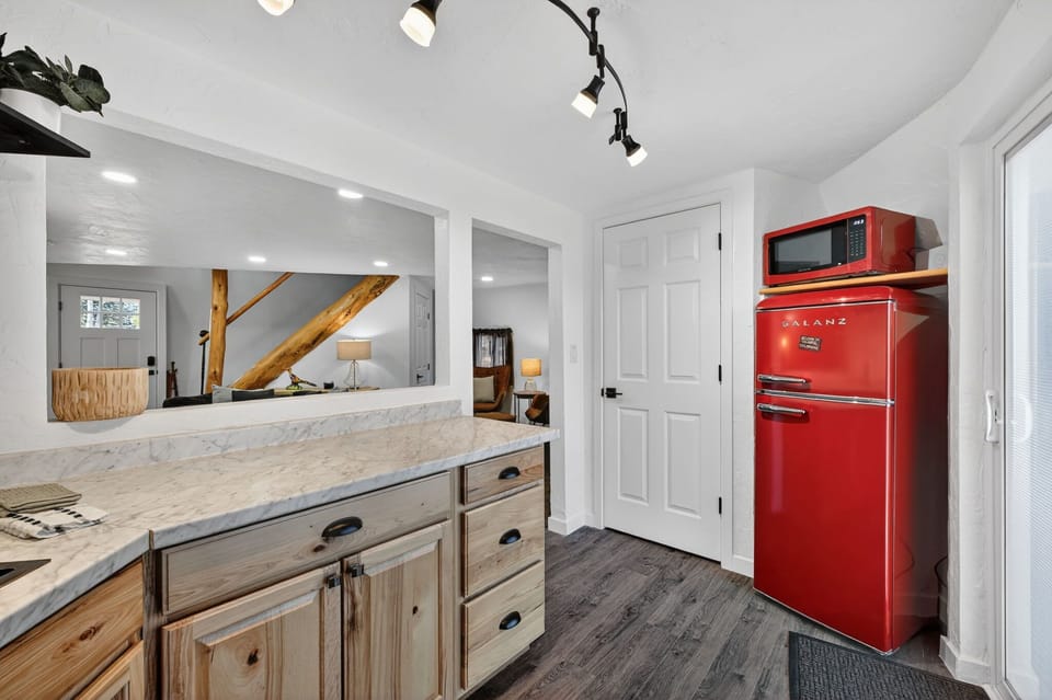 The kitchen has a refrigerator, microwave and a small stove/oven as well as all the cooking utensils and dinnerware you may need. 