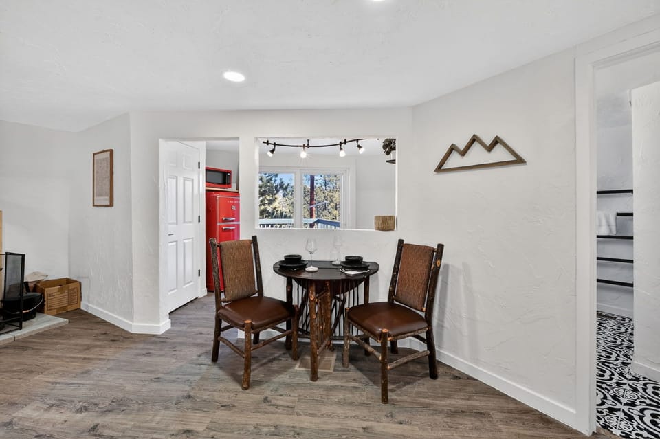 There is a window from the kitchen into the dining/living room area. 