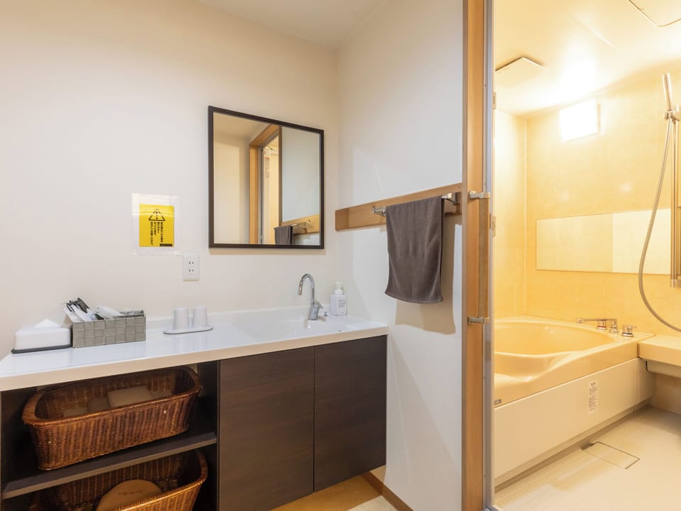 Standard Twin Room, Non Smoking | Bathroom | Combined shower/tub, hair dryer, slippers, electronic bidet